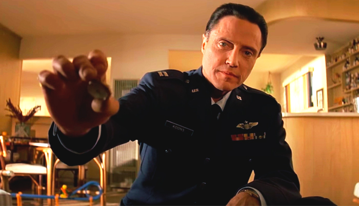 Christopher Walken holding the coin